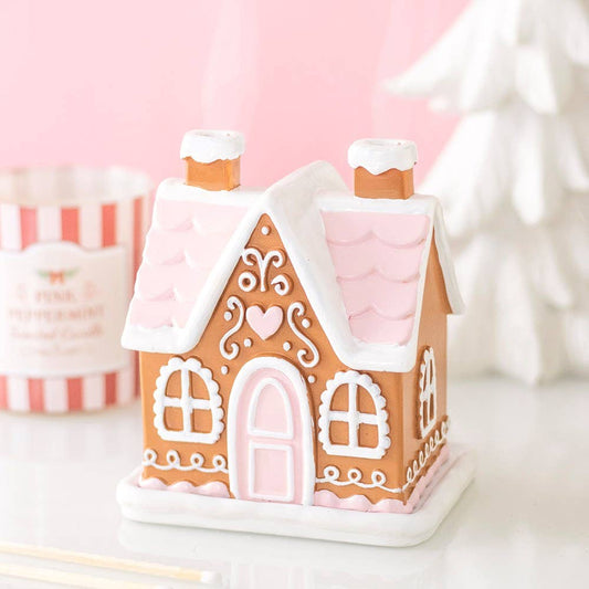 Roze peperkoekenhuisje geurkegelbrander